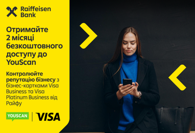 Рекламний банер від Райффайзен Банку та Visa зображує сучасний діловий образ жінки, пропонуючи власникам карток Visa Business та Visa Platinum Business два місяці безкоштовного доступу до сервісу YouScan.