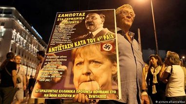 Почему греки дорисовывают Меркель усы Гитлера