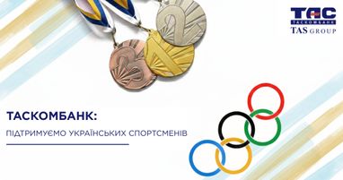 Олімпійські медалі та кільця на світлому фоні з текстом про підтримку українських спортсменів від «Таскомбанк»